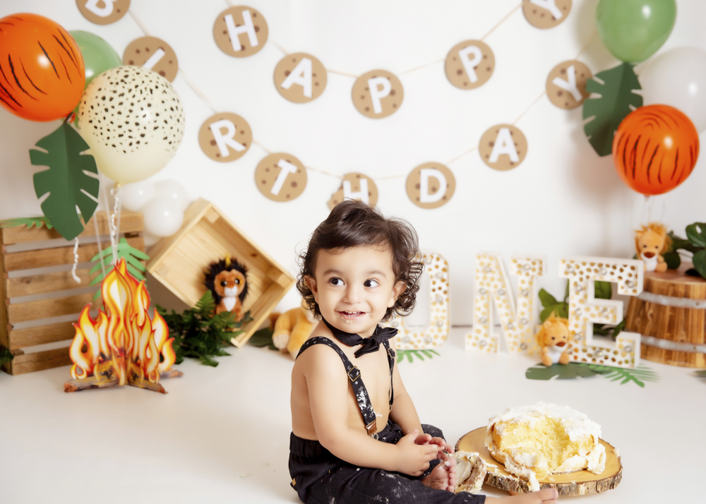 Little boy smiling at a birthday photo session in studio in calgary
